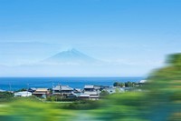 Clustered houses near ocean across Mt. Fuji. Original public domain image from Wikimedia Commons