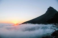 Foggy sunset below peak during dusk in Cape Town. Original public domain image from <a href="https://commons.wikimedia.org/wiki/File:Cape_Town_foggy_sunset_(Unsplash).jpg" target="_blank" rel="noopener noreferrer nofollow">Wikimedia Commons</a>