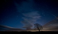 A night-time background featuring a blue sky with gusty dark clouds in Malham Cove. Original public domain image from Wikimedia Commons