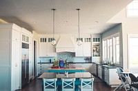 Blue and white kitchen interior with open concept with island and large windows. Original public domain image from Wikimedia Commons