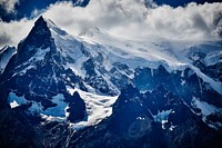 Rocky peak of Grey Glacier covered in snow under cloudy sky. Original public domain image from <a href="https://commons.wikimedia.org/wiki/File:Pyramids_of_Chile_(Unsplash).jpg" target="_blank" rel="noopener noreferrer nofollow">Wikimedia Commons</a>