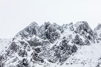 A snow-capped jagged mountain ridge in Schwägalp. Original public domain image from Wikimedia Commons