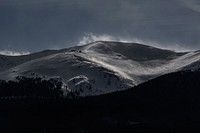 A snow-covered mountain slope with a ski lift in the evening. Original public domain image from <a href="https://commons.wikimedia.org/wiki/File:Ski_resort_on_a_snowy_slope_(Unsplash).jpg" target="_blank" rel="noopener noreferrer nofollow">Wikimedia Commons</a>