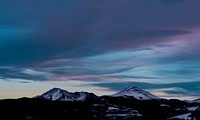 A mountain peak rising up against the cloudy evening sky in Silverthorne. Original public domain image from Wikimedia Commons