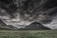 Dark, storm clouds above the valley with small rocky hills at Glencoe. Original public domain image from <a href="https://commons.wikimedia.org/wiki/File:Dark_clouds_above_the_hilly_valley_(Unsplash).jpg" target="_blank" rel="noopener noreferrer nofollow">Wikimedia Commons</a>