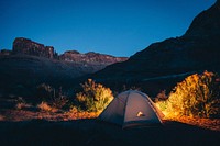 White camping tent beside the mountain. Original public domain image from Wikimedia Commons