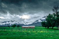 Cloudy skies over a lush green pasture with an abandoned barn. Original public domain image from <a href="https://commons.wikimedia.org/wiki/File:Greener_Pastures_(Unsplash).jpg" target="_blank" rel="noopener noreferrer nofollow">Wikimedia Commons</a>