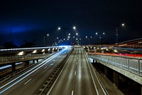 Long exposure shot of the city's traffice at night. Original public domain image from Wikimedia Commons