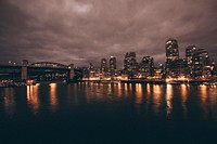 Harbor at night in Toronto, Canada. Original public domain image from <a href="https://commons.wikimedia.org/wiki/File:Vanouver_Harbour_(Unsplash).jpg" target="_blank">Wikimedia Commons</a>