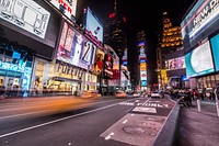 Time lapse shot of cars driving through Times Square, New York at night-time. Original public domain image from Wikimedia Commons