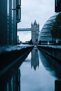 A low shot of a canal in London with a view on the Tower Bridge. Original public domain image from Wikimedia Commons