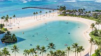 A closed-off sea inlet with people on kayaks and small boats surrounded by a palm-fringed beach. Original public domain image from Wikimedia Commons