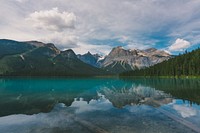 An emerald-green surface of a lake near granite mountains in Yoho National Park. Original public domain image from Wikimedia Commons