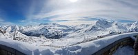 Panorama of a mountain range covered in a thick layer of snow in the Austrian Alps. Original public domain image from Wikimedia Commons