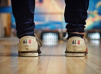 Person standing on bowling court. Original public domain image from Wikimedia Commons