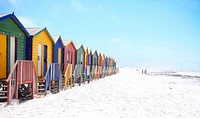 Colorful beach huts on a white sand beach in Muizenberg. Original public domain image from Wikimedia Commons