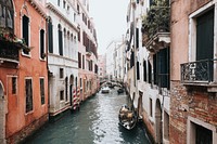 A canal in Venice with a gondola in front and a bridge in the back. Original public domain image from <a href="https://commons.wikimedia.org/wiki/File:Canal_in_Venice_(Unsplash).jpg" target="_blank" rel="noopener noreferrer nofollow">Wikimedia Commons</a>