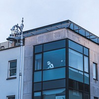 A Star Wars stormtrooper in an office window seen from the outside. Original public domain image from Wikimedia Commons