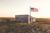 Small building with an American flag at Chatham beach. Original public domain image from Wikimedia Commons