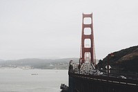 Long shot of Golden Gate Bridge busy traffic and San Francisco Bay. Original public domain image from Wikimedia Commons