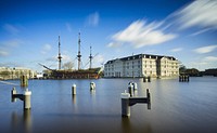 White concrete structure during daytime. Original public domain image from <a href="https://commons.wikimedia.org/wiki/File:National_Maritime_Museum,_Amsterdam,_Netherlands_(Unsplash).jpg" target="_blank">Wikimedia Commons</a>