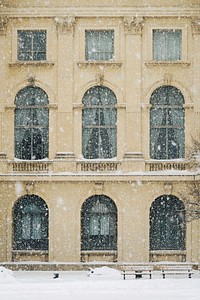 Snow blowing in front of an old building in Bucharest during the winter. Original public domain image from Wikimedia Commons