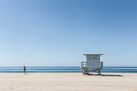 Lifeguard stand in tranquil beach photo of ocean and shoreline in a summer day. Original public domain image from Wikimedia Commons