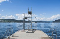 A pier with ladders a diving board on a tranquil lake. Original public domain image from <a href="https://commons.wikimedia.org/wiki/File:Dr%C3%B8bak_lake_pier_(Unsplash).jpg" target="_blank" rel="noopener noreferrer nofollow">Wikimedia Commons</a>
