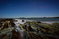 A look at the ocean near North Head Camp in the early night under a starlit sky. Original public domain image from Wikimedia Commons