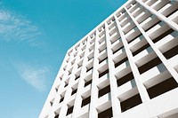 A white building facade with a cruciform pattern. Original public domain image from Wikimedia Commons