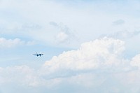 a plane in the sky. Original public domain image from Wikimedia Commons