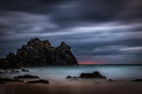 Sunset during storm is comimg to the island. Bermagui, Australia. Original public domain image from Wikimedia Commons