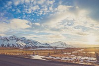 Landscape view of snow covered mountains with a clear sky and fenced in the desert. Original public domain image from <a href="https://commons.wikimedia.org/wiki/File:Nature_is_the_best_artist_(Unsplash).jpg" target="_blank">Wikimedia Commons</a>