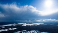 Cloudscape photography of the sunshine coming through from above the overcast. Original public domain image from Wikimedia Commons