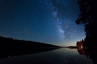 Bright stars reflected in a lake at night. Original public domain image from <a href="https://commons.wikimedia.org/wiki/File:Stars_in_a_lake_(Unsplash).jpg" target="_blank" rel="noopener noreferrer nofollow">Wikimedia Commons</a>
