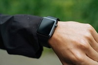 A close-up of an Apple Watch and raindrops on a man's arm. Original public domain image from Wikimedia Commons