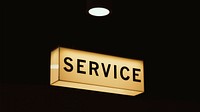 A “service” sign in a room lit up at night. Original public domain image from Wikimedia Commons