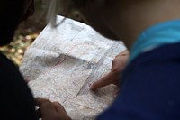 Tourists looking at the map. Original public domain image from Wikimedia Commons