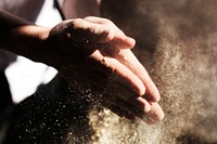 Clapping hands with sand. Original public domain image from Wikimedia Commons