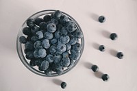 Bowl of blueberries overflowing onto the counter for a healthy snack. Original public domain image from <a href="https://commons.wikimedia.org/wiki/File:Bowl_of_Blueberries_(Unsplash).jpg" target="_blank" rel="noopener noreferrer nofollow">Wikimedia Commons</a>