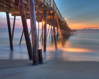 Under wooden dock during sunset. Original public domain image from Wikimedia Commons