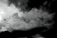 A black and white photograph of storm clouds. Original public domain image from Wikimedia Commons