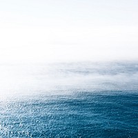 Fog rolls over wavy blue waters in Portugal. Original public domain image from Wikimedia Commons