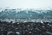 Small wave washing on a pebble beach. Original public domain image from <a href="https://commons.wikimedia.org/wiki/File:Wave_washing_on_pebble_beach_(Unsplash).jpg" target="_blank" rel="noopener noreferrer nofollow">Wikimedia Commons</a>