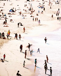 A high-angle shot of a crowded beach in the summertime. Original public domain image from Wikimedia Commons