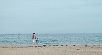 Father and son walking, beach. Original public domain image from Wikimedia Commons