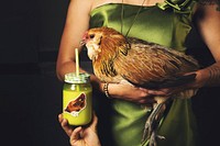 Chicken in woman&#39;s arms, green jar. Original public domain image from <a href="https://commons.wikimedia.org/wiki/File:Eagle_the_chicken_(Unsplash).jpg" target="_blank">Wikimedia Commons</a>