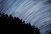 A vibrant astrophotography shot featuring moving stars in Longmont. Original public domain image from <a href="https://commons.wikimedia.org/wiki/File:Longmont_star_trails_(Unsplash).jpg" target="_blank">Wikimedia Commons</a>