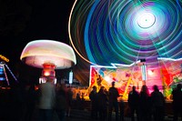 A ride at an amusement park with light trails, plus the Perth Royal Show crowd. Original public domain image from Wikimedia Commons