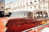 Vintage car parked in front of the building. Original public domain image from <a href="https://commons.wikimedia.org/wiki/File:Havana,_Cuba_(Unsplash_Nll7q6ctAG8).jpg" target="_blank">Wikimedia Commons</a>